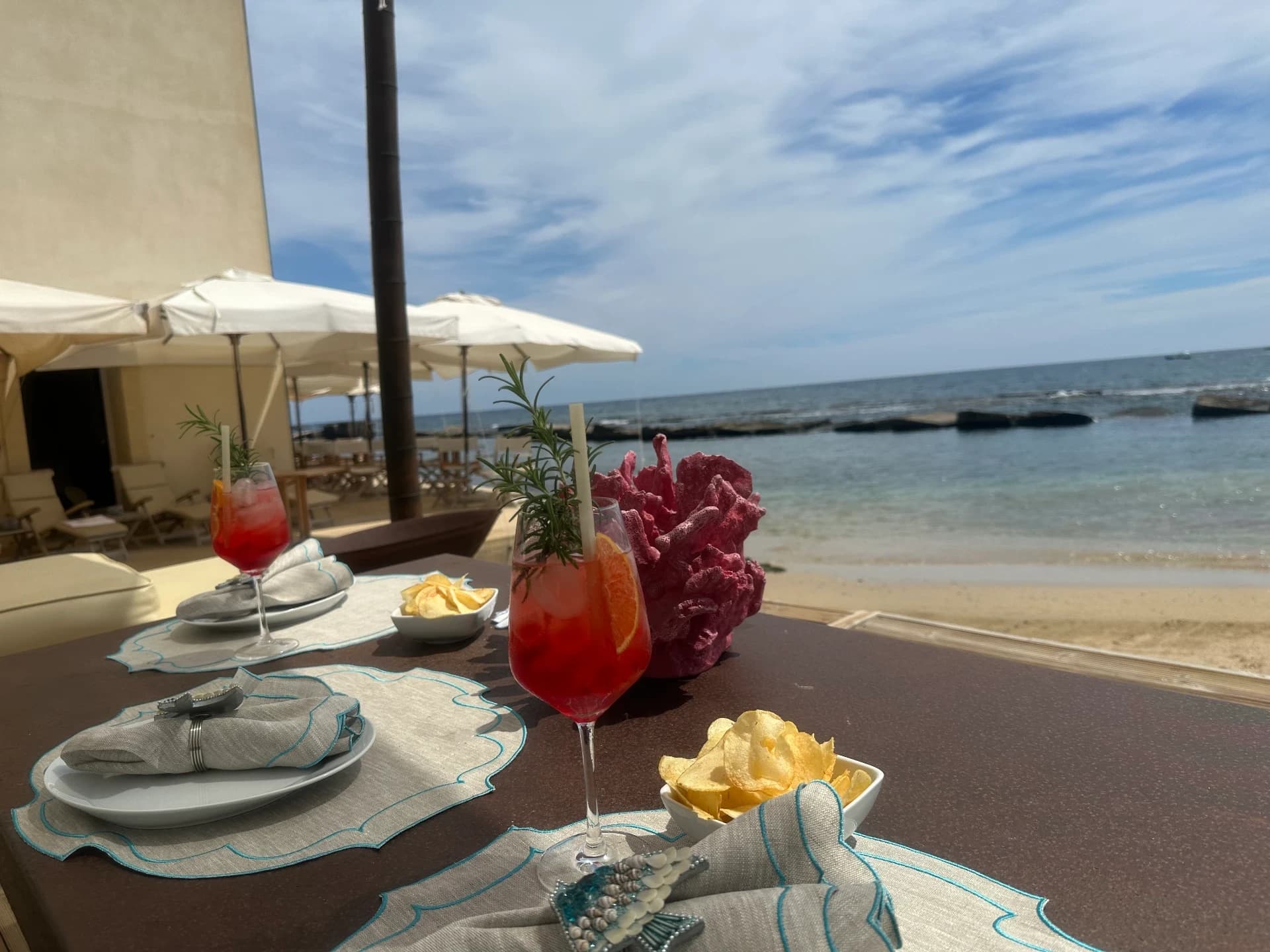 Aperitif on the beach facing the sea