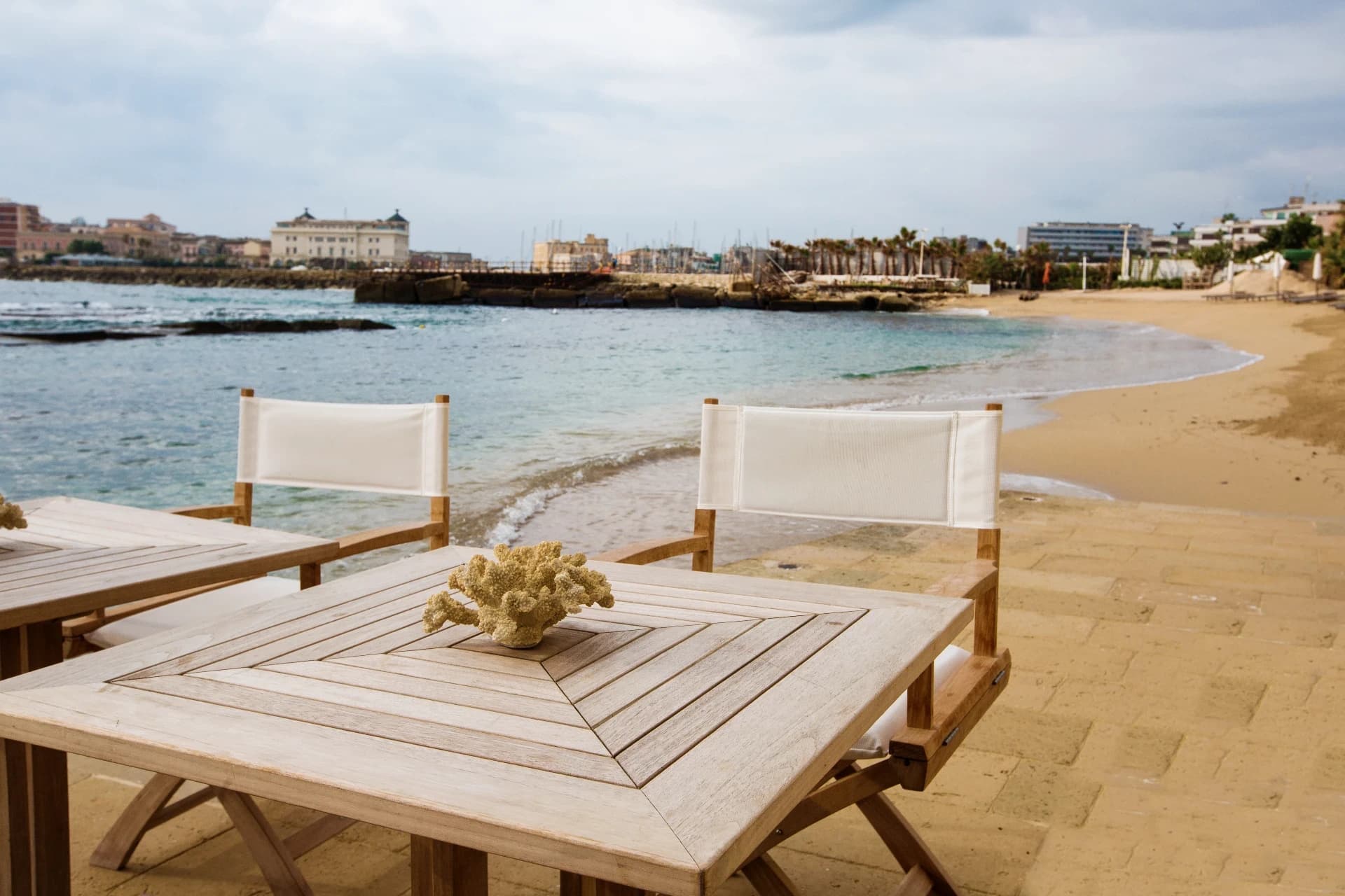 Seafront terrace with wooden table