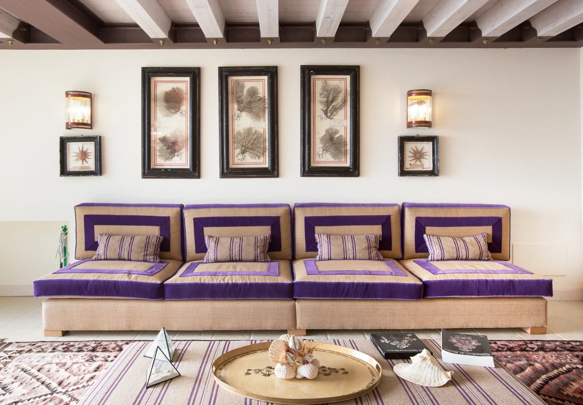 Sofa with marine prints on the walls