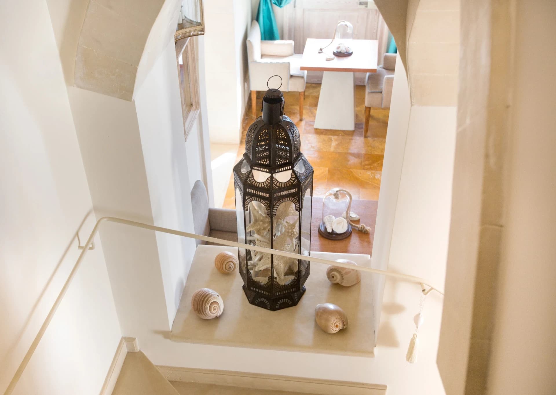 Stairwell with lantern and seashells
