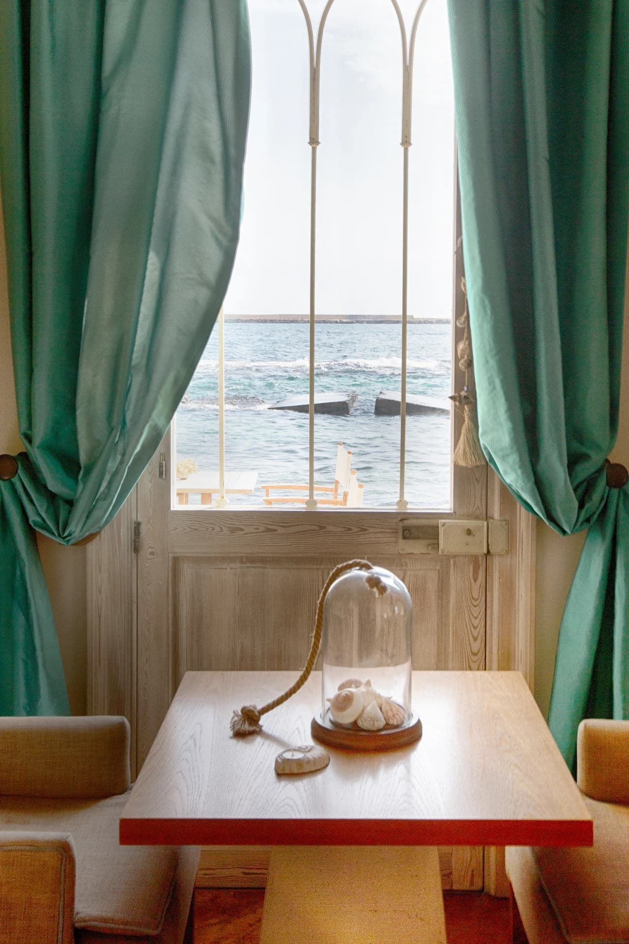 Sea-view window with curtains