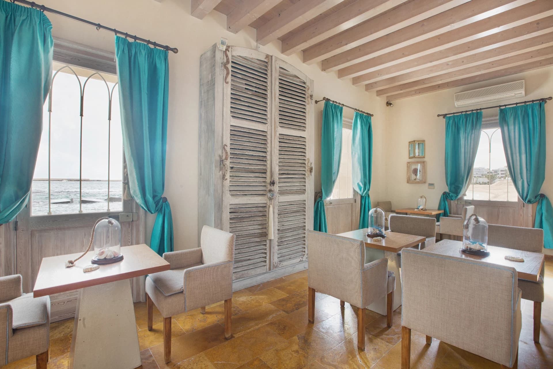 Bright breakfast room with tables