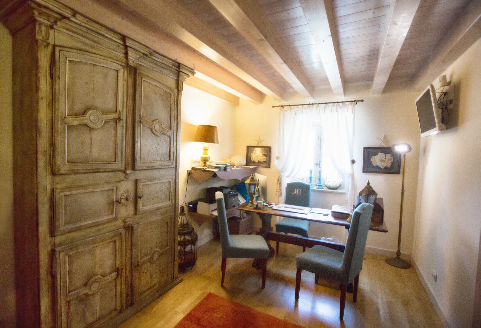 Room with antique wardrobe and desk