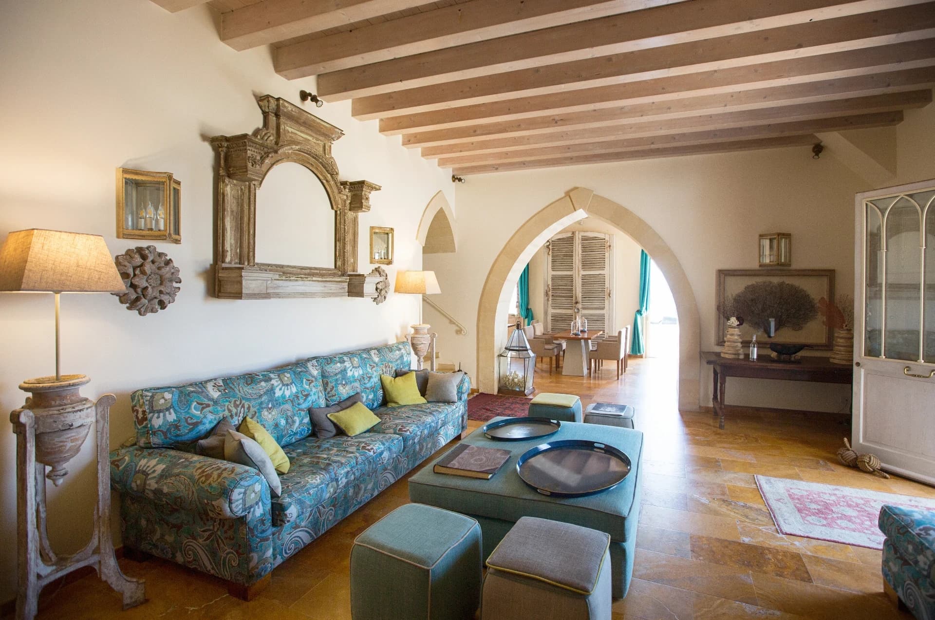 Lounge with floral sofa and arches