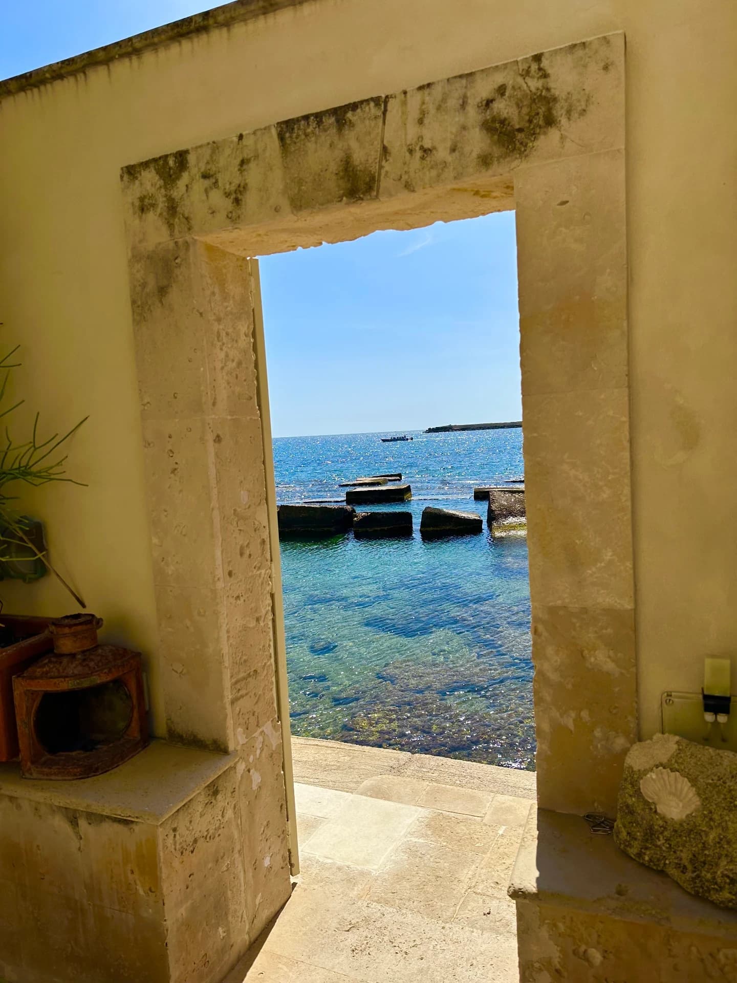 Sea glimpse through a stone doorway