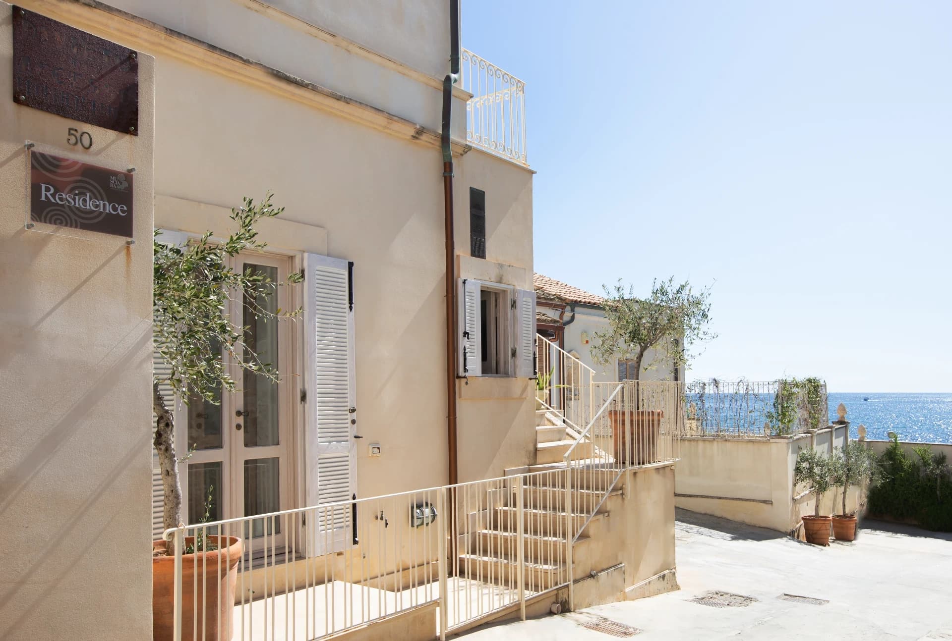 Residence entrance with olive tree