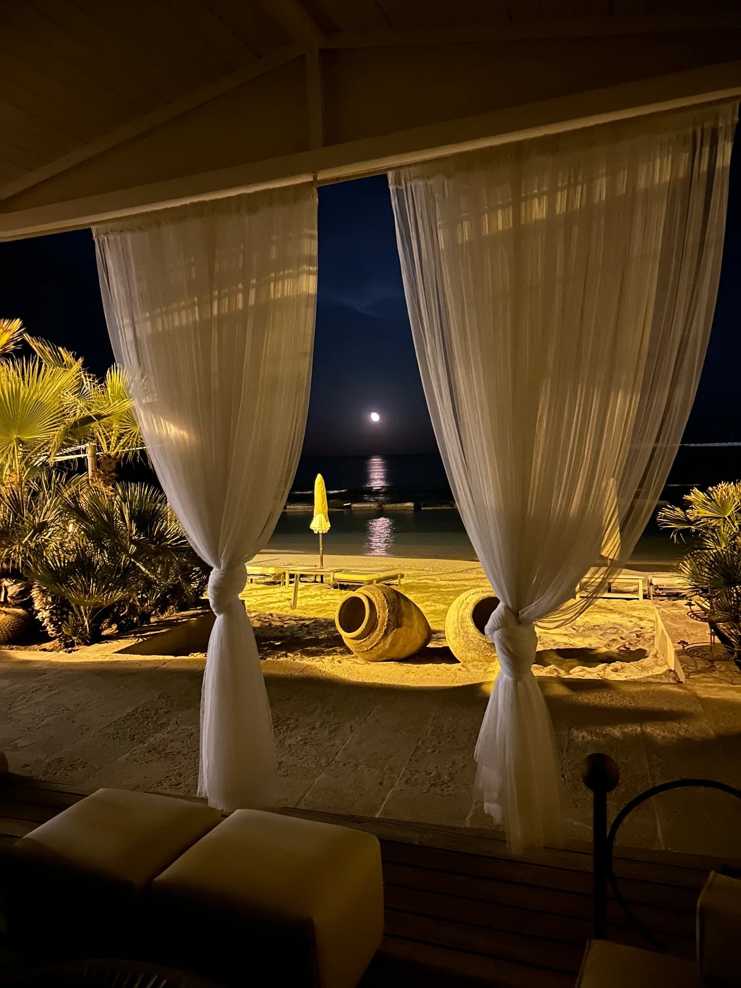 Seafront terrace in the moonlight