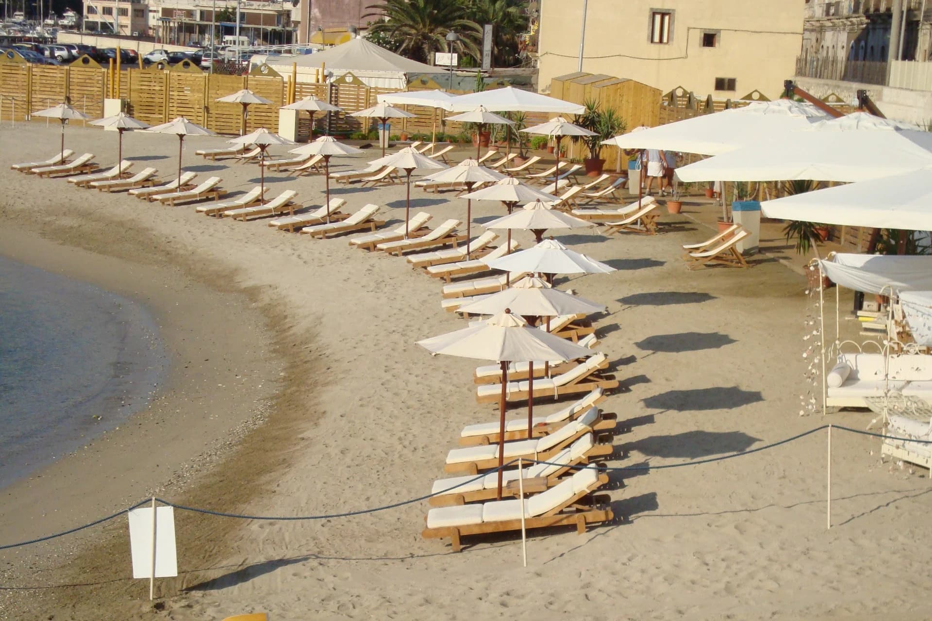 Rows of sunbeds on the private beach